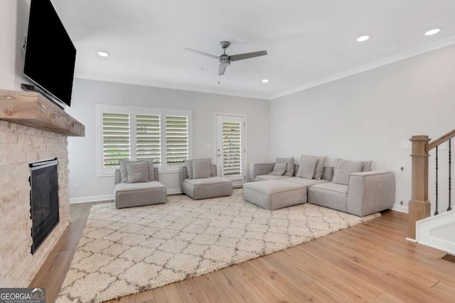 1768 Evenstad Way, Smyrna, GA 30080 - living room featuring stairway, a ceiling fan, crown molding, wood finished floors, and a fireplace