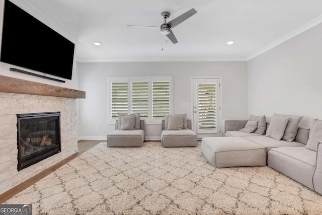 1768 Evenstad Way, Smyrna, GA 30080 - living area featuring crown molding, ceiling fan, wood finished floors, a stone fireplace, and recessed lighting