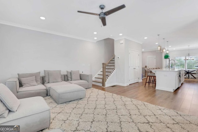 1768 Evenstad Way, Smyrna, GA 30080 - living room with wood finished floors, ceiling fan, ornamental molding, recessed lighting, and stairway