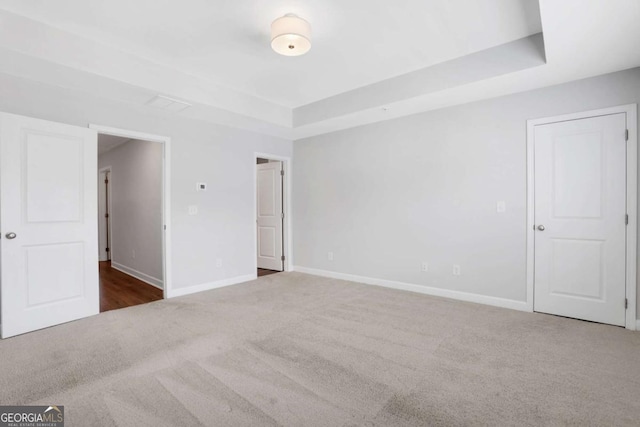 1768 Evenstad Way, Smyrna, GA 30080 - unfurnished room featuring carpet, a tray ceiling, and baseboards