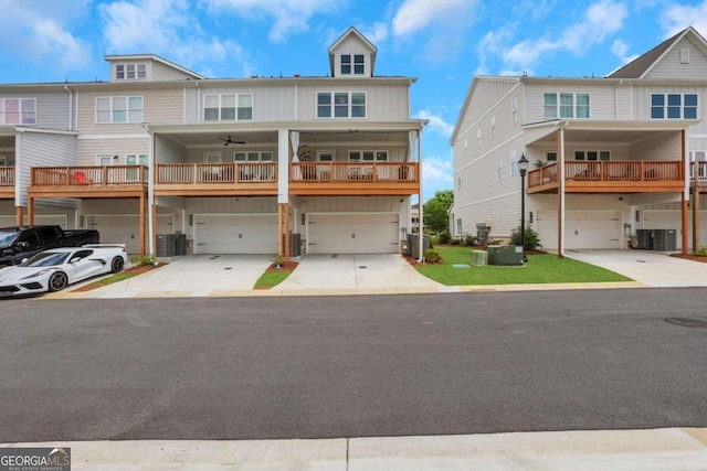 1768 Evenstad Way, Smyrna, GA 30080 - townhome / multi-family property featuring an attached garage, driveway, central AC, and board and batten siding
