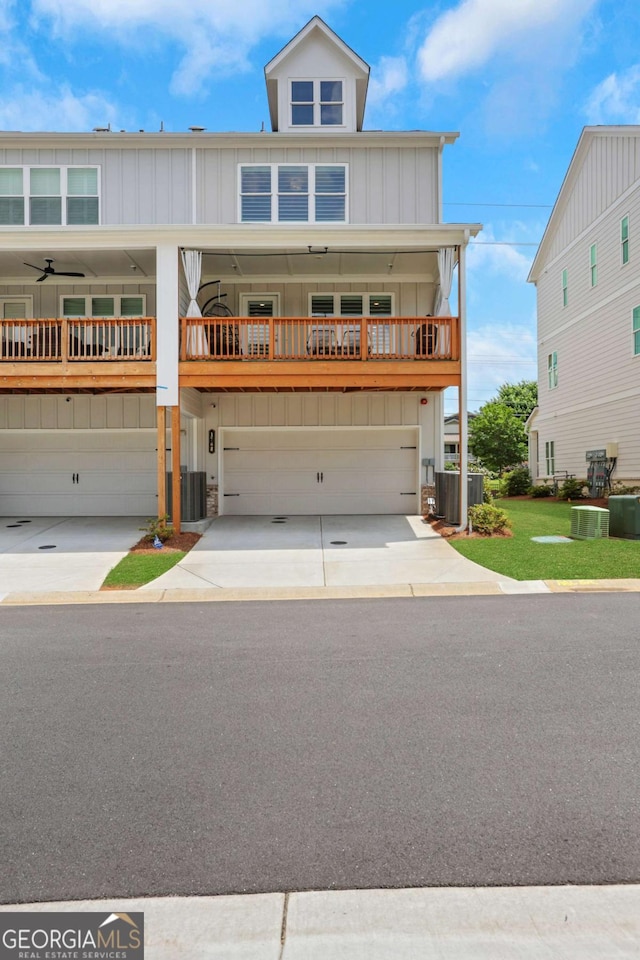 1768 Evenstad Way, Smyrna, GA 30080 - view of front of property with a garage, driveway, board and batten siding, and central air condition unit