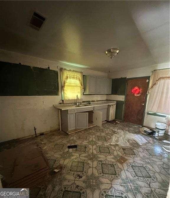 770 E Park Ave, Savannah, GA 31401 - kitchen with light countertops and a sink