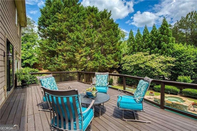 wooden terrace featuring an outdoor hot tub