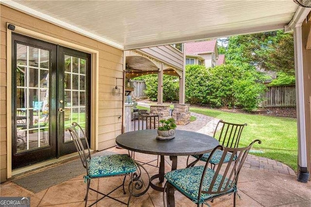 view of patio featuring outdoor dining space and french doors