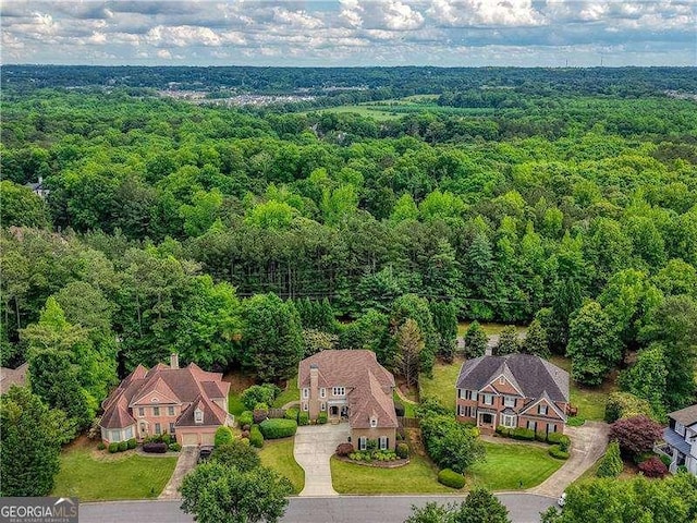 view from above of property with a forest