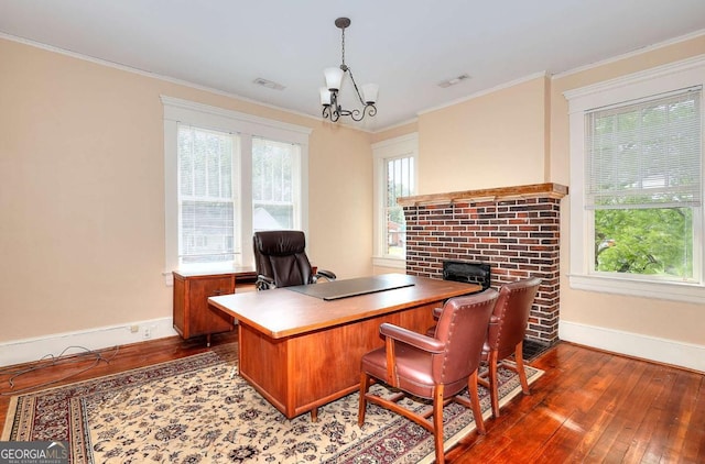 338 N Broad St, Monroe, GA 30655 - office featuring hardwood / wood-style flooring, baseboards, a chandelier, a fireplace, and ornamental molding