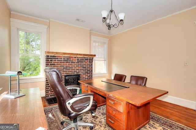 338 N Broad St, Monroe, GA 30655 - office featuring baseboards, wood finished floors, a chandelier, and ornamental molding