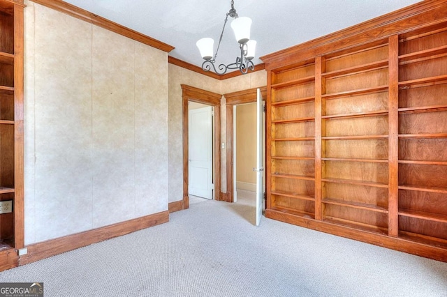 338 N Broad St, Monroe, GA 30655 - carpeted empty room with a chandelier, ornamental molding, and baseboards