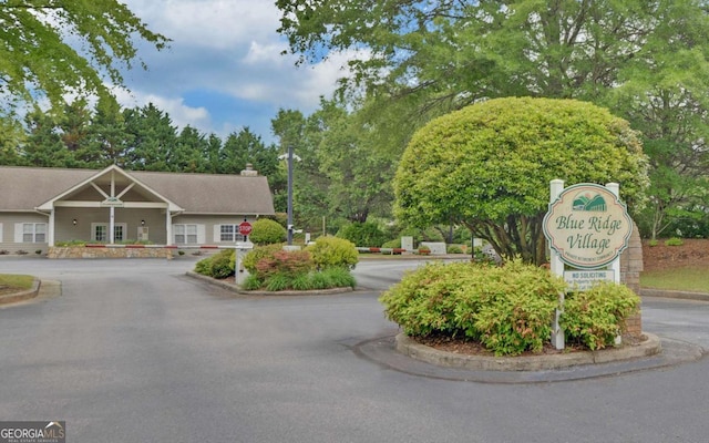 48 Morningview Pl, Blue Ridge, GA 30513 - view of asphalt road with curbs, traffic signs, and view of wooded area