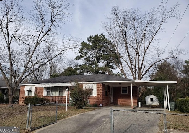2227 Robin Hood Rd, Macon, GA 31206 - view of front of property with brick siding, an attached carport, asphalt driveway, and a gate