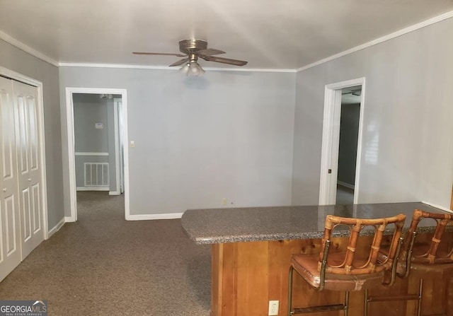 2227 Robin Hood Rd, Macon, GA 31206 - dining area featuring ceiling fan, crown molding, carpet floors, and baseboards