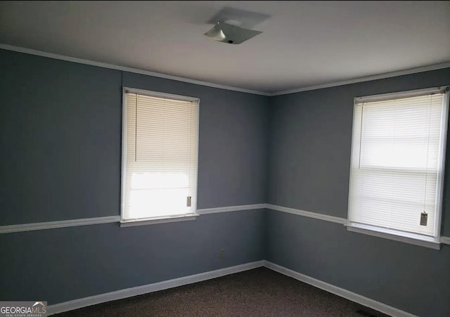 2227 Robin Hood Rd, Macon, GA 31206 - empty room with baseboards, crown molding, and dark carpet