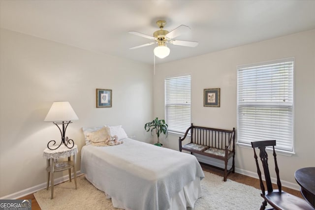 2507 Wateringhole Ct, Statesboro, GA 30458 - bedroom with light wood finished floors, baseboards, and a ceiling fan