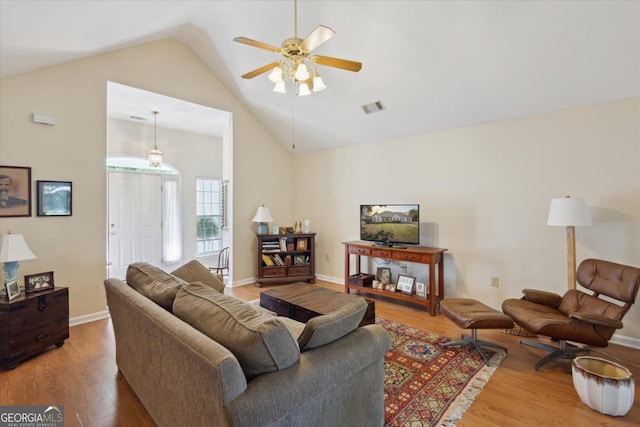 2507 Wateringhole Ct, Statesboro, GA 30458 - living room featuring vaulted ceiling, wood finished floors, a ceiling fan, and baseboards
