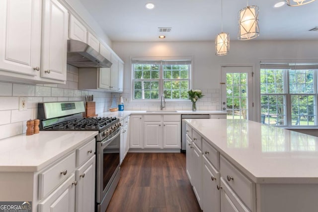 5281 Tormeall Trce, Suwanee, GA 30024 - kitchen with stainless steel appliances, under cabinet range hood, recessed lighting, light countertops, and white cabinetry