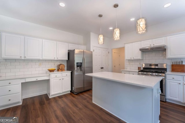 5281 Tormeall Trce, Suwanee, GA 30024 - kitchen with appliances with stainless steel finishes, backsplash, under cabinet range hood, white cabinets, and recessed lighting