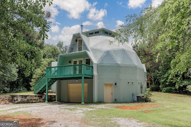218 Wedgewood Dr, Danielsville, GA 30633 - view of front of house featuring a balcony, an attached garage, driveway, central AC, and a front yard