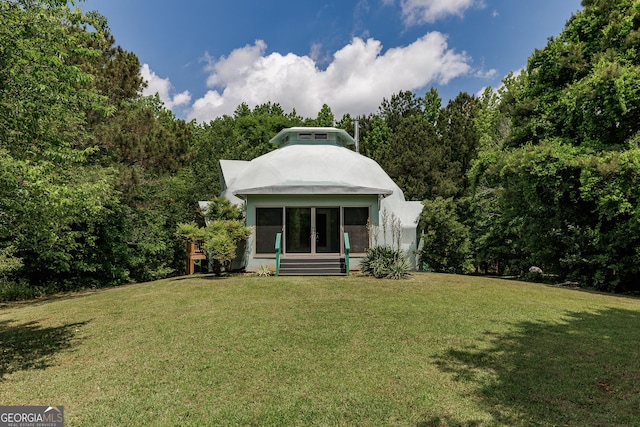 218 Wedgewood Dr, Danielsville, GA 30633 - back of house featuring a lawn and a wooded view