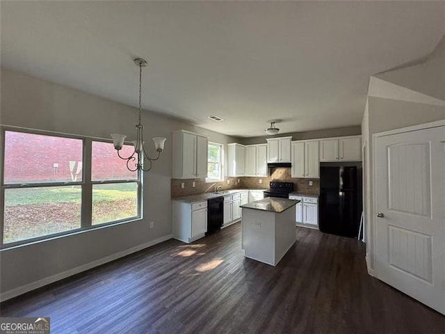4287 Traipse Path, Ellenwood, GA 30294 - kitchen with black appliances, dark wood-style flooring, white cabinets, and tasteful backsplash