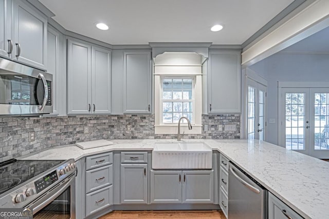 1443 Ebenezer Rd, Rincon, GA 31326 - kitchen with gray cabinetry, appliances with stainless steel finishes, a sink, and recessed lighting