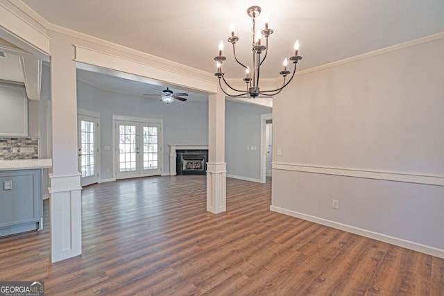 1443 Ebenezer Rd, Rincon, GA 31326 - unfurnished living room with a chandelier, a ceiling fan, ornamental molding, dark wood-style flooring, and a fireplace