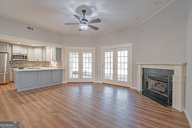 1443 Ebenezer Rd, Rincon, GA 31326 - unfurnished living room with ceiling fan, a high end fireplace, wood finished floors, ornamental molding, and baseboards