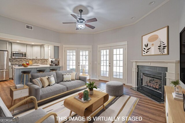 1443 Ebenezer Rd, Rincon, GA 31326 - living room featuring a premium fireplace, ceiling fan, light wood finished floors, ornamental molding, and recessed lighting