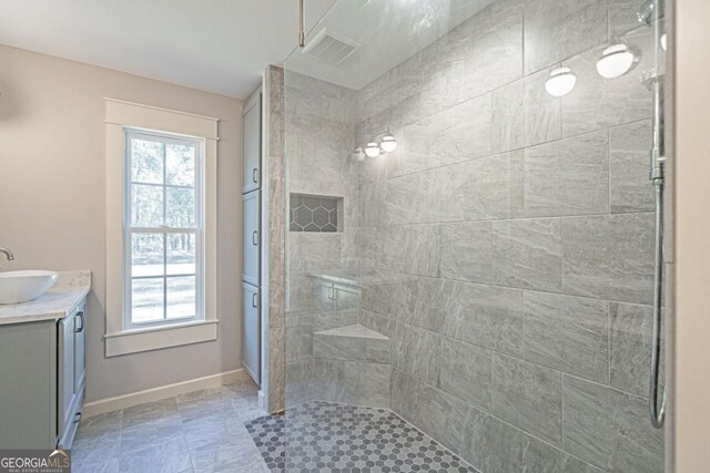 1443 Ebenezer Rd, Rincon, GA 31326 - full bath with a tile shower, vanity, and baseboards