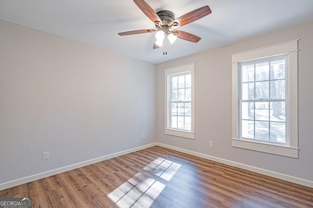 1443 Ebenezer Rd, Rincon, GA 31326 - spare room featuring baseboards, wood finished floors, and a ceiling fan