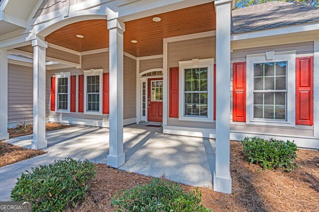 1443 Ebenezer Rd, Rincon, GA 31326 - doorway to property featuring a porch and roof with shingles