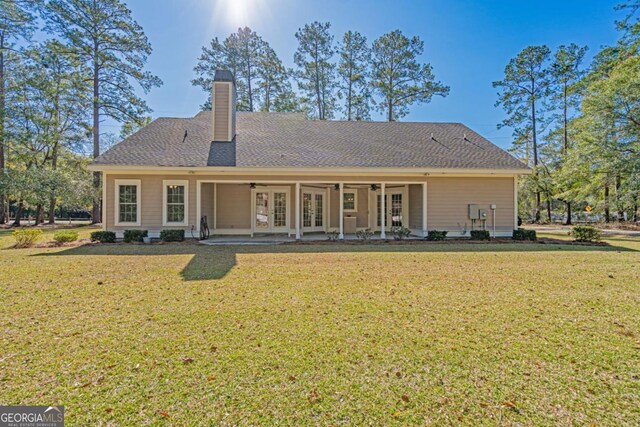 1443 Ebenezer Rd, Rincon, GA 31326 - rear view of house with french doors, a ceiling fan, a yard, and a chimney