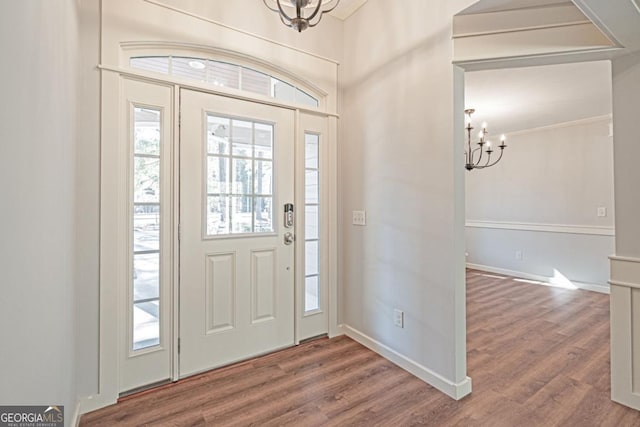 1443 Ebenezer Rd, Rincon, GA 31326 - foyer entrance with a chandelier, wood finished floors, and healthy amount of natural light