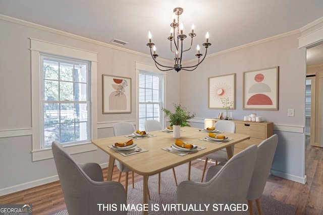 1443 Ebenezer Rd, Rincon, GA 31326 - dining room with a chandelier, wood finished floors, crown molding, and baseboards