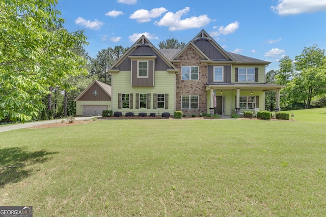 495 George Coggin Rd, Newnan, GA 30265 - craftsman-style house featuring board and batten siding, a front yard, and a porch