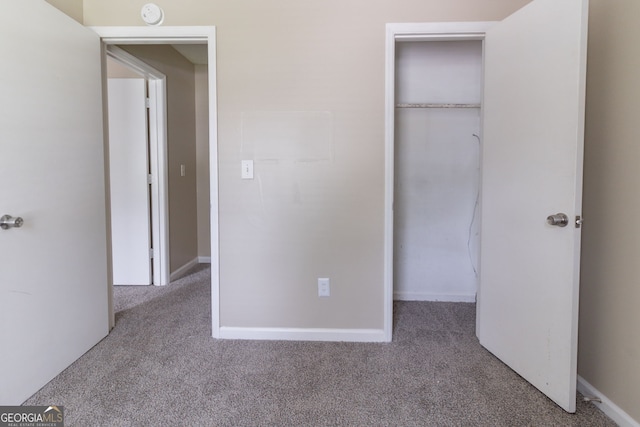 5339 Biffle Downs Rd, Stone Mountain, GA 30088 - unfurnished bedroom featuring carpet and a closet