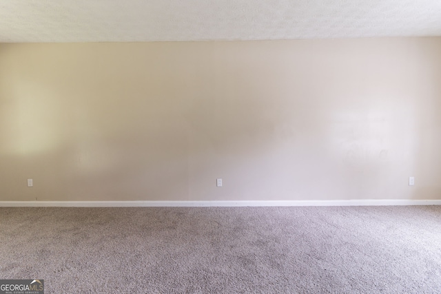 5339 Biffle Downs Rd, Stone Mountain, GA 30088 - carpeted empty room featuring baseboards and a textured ceiling