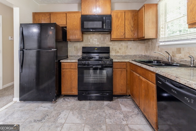 5339 Biffle Downs Rd, Stone Mountain, GA 30088 - kitchen with black appliances, decorative backsplash, light countertops, and brown cabinetry