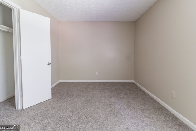 5339 Biffle Downs Rd, Stone Mountain, GA 30088 - unfurnished bedroom with carpet and a textured ceiling