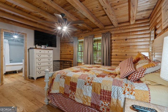 bedroom featuring rustic walls, wooden ceiling, wood finished floors, and beamed ceiling