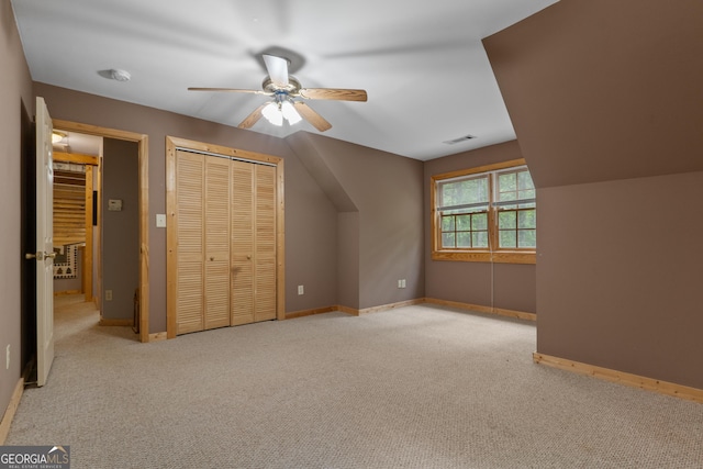 bonus room featuring carpet flooring, a ceiling fan, and baseboards