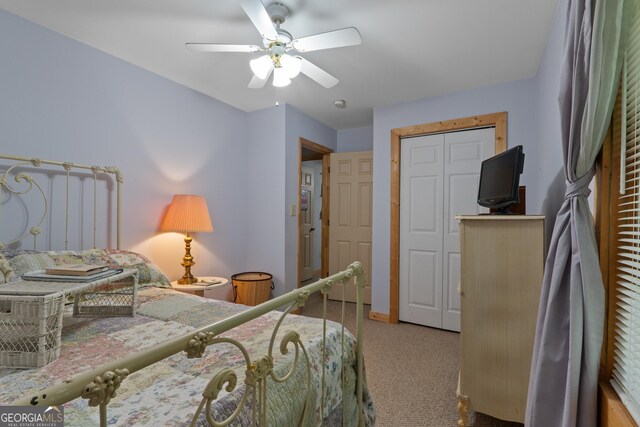 bedroom with carpet, ceiling fan, and baseboards