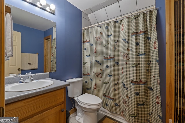 full bathroom with toilet, vanity, and a shower with curtain