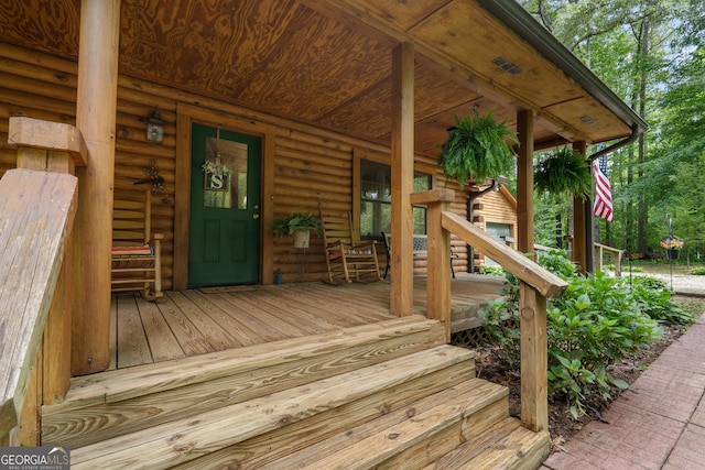 wooden terrace with covered porch