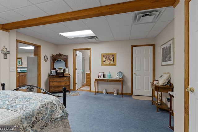 bedroom featuring carpet flooring, freestanding refrigerator, baseboards, connected bathroom, and a paneled ceiling