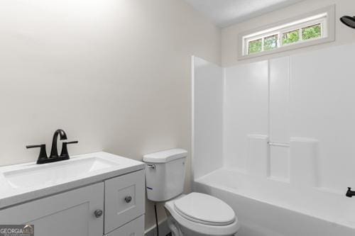 bathroom with toilet and vanity