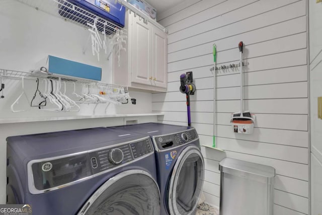 1025 Saint Marks Walk, Suwanee, GA 30024 - washroom featuring cabinet space, washer and dryer, and wood walls