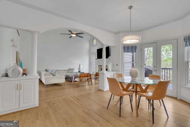 1025 Saint Marks Walk, Suwanee, GA 30024 - dining area featuring ornate columns, healthy amount of natural light, and light wood-type flooring
