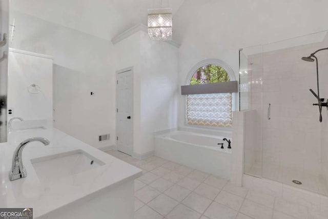 1025 Saint Marks Walk, Suwanee, GA 30024 - bathroom featuring a shower stall, a garden tub, double vanity, and tile patterned flooring