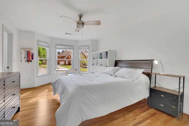 1025 Saint Marks Walk, Suwanee, GA 30024 - bedroom featuring light wood-style floors and ceiling fan
